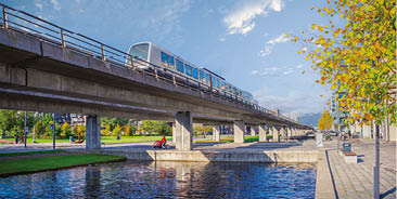 Copenhagen, Denmark - 10.20.2021: automatic driverless metro subway M1 line rides over a bridgenear the  restads Boulevard in the  restad city area in Copenhagen, Denmark