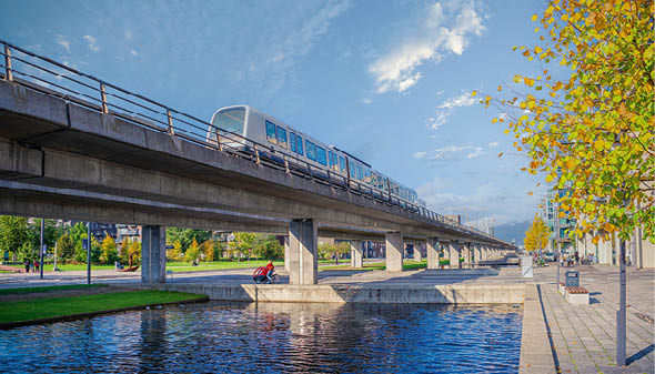 Copenhagen, Denmark - 10.20.2021: automatic driverless metro subway M1 line rides over a bridgenear the  restads Boulevard in the  restad city area in Copenhagen, Denmark