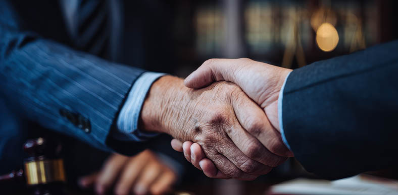 Professionals connecting through greetings and agreements lawyers and clients shaking hands for consultations and legal advice
